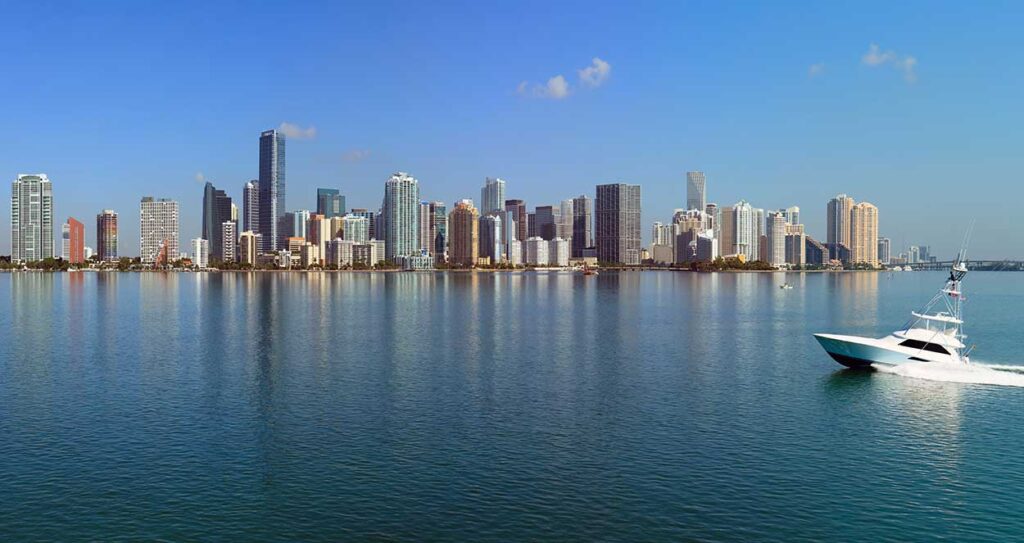 A moving boat with Miami's skyline in the background